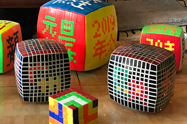 Most Characters Formed by Rotating a 14-Layer Rubik's Cube on Six Faces